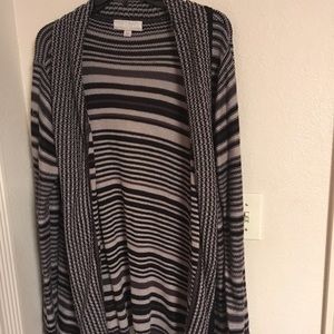 Large asymmetrical hem cardigan.